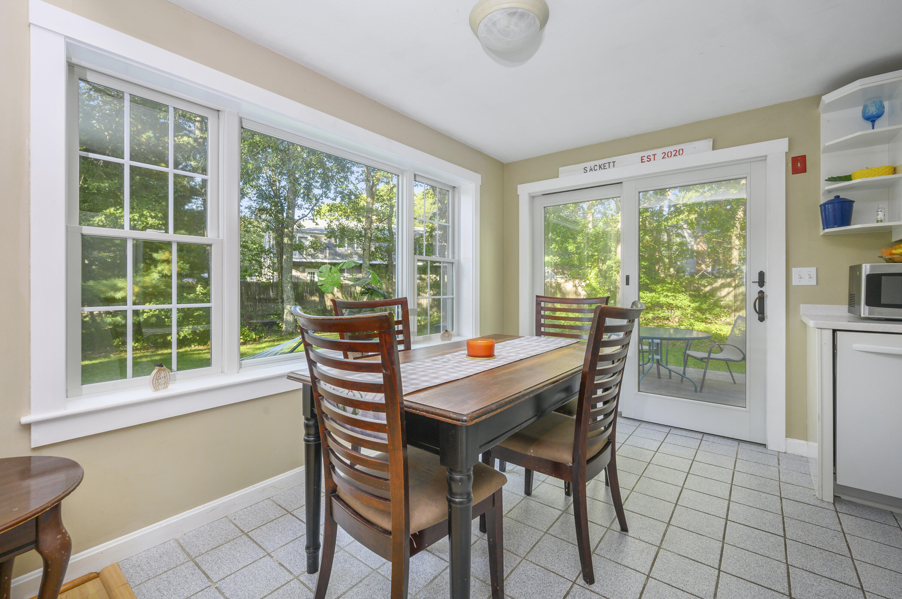 52 Zeno Crocker Road Centerville, MA 02632 - Photo 6 of 20 a view of a dining room with furniture window and outside view