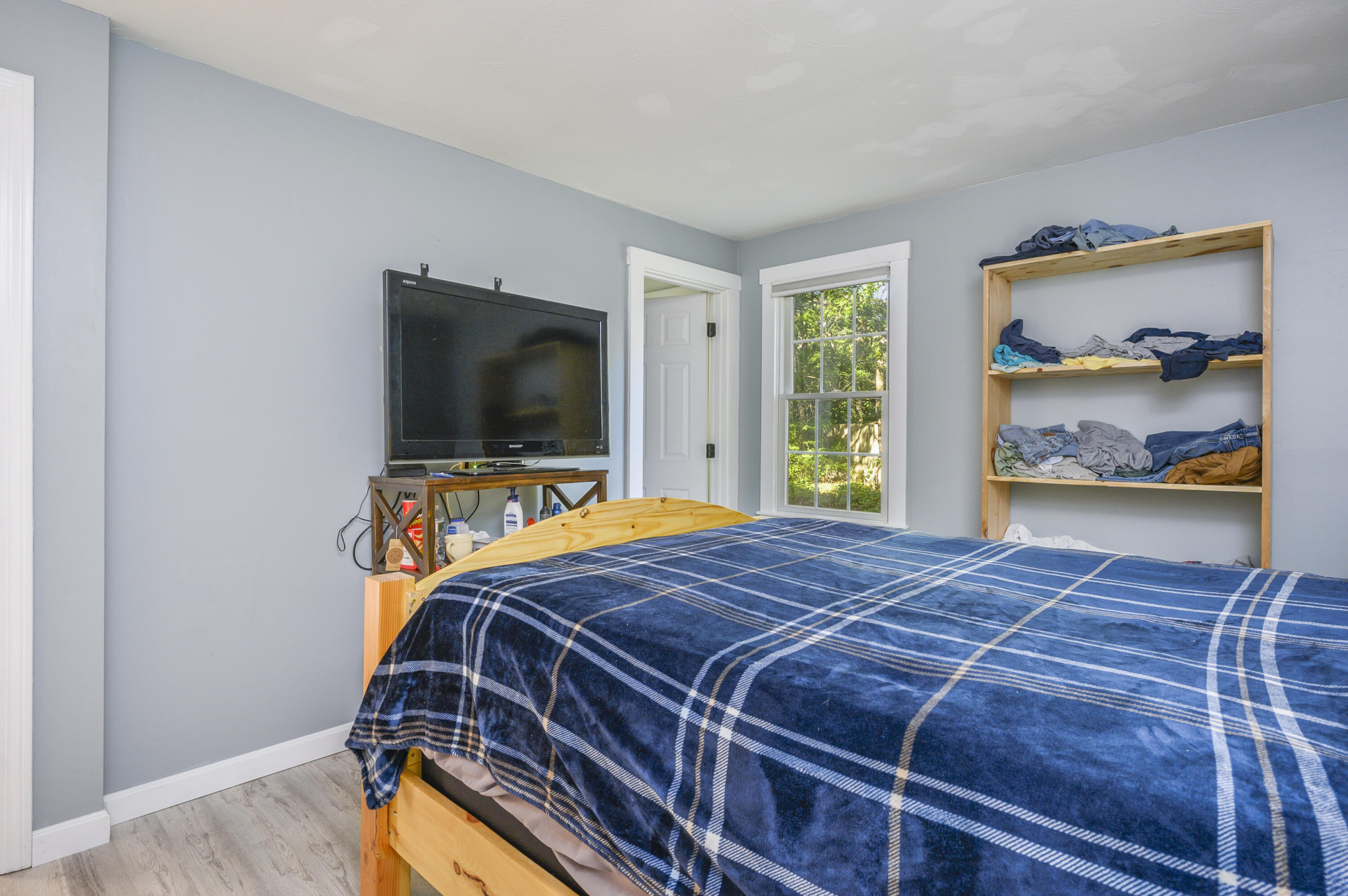 52 Zeno Crocker Road Centerville, MA 02632 - Photo 9 of 20 a bedroom with a bed and a flat screen tv