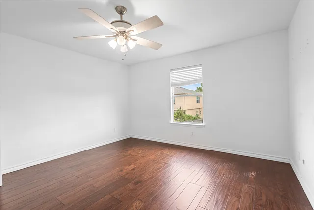 a workspace with wooden floor and a window