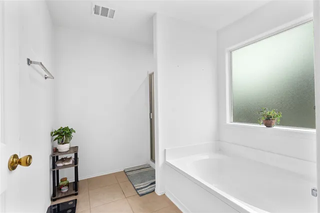 a view of a house with a backyard patio and swimming pool