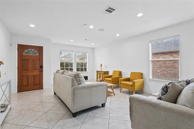 a living room with furniture and a table