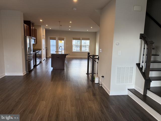 711 Quarry Point Road Malvern, PA 19355 - Photo 11 of 26 a view of a hallway with wooden floor and stairs