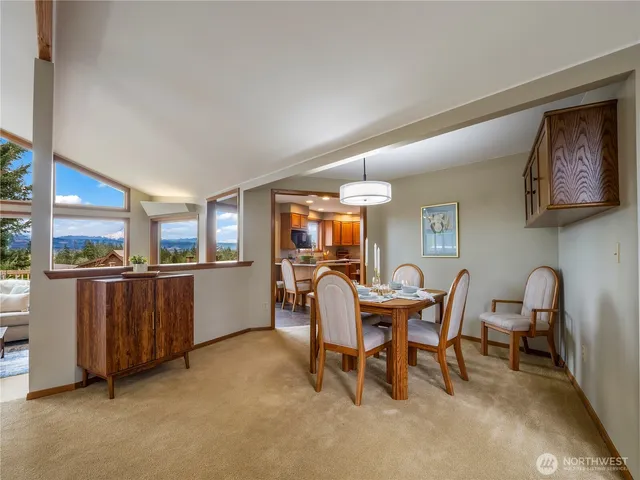 a view of a dining area with furniture window and outside view