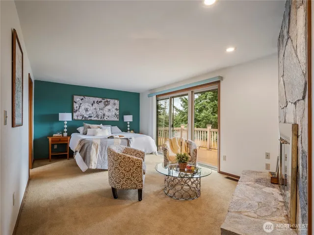 a bedroom with bed and a fireplace