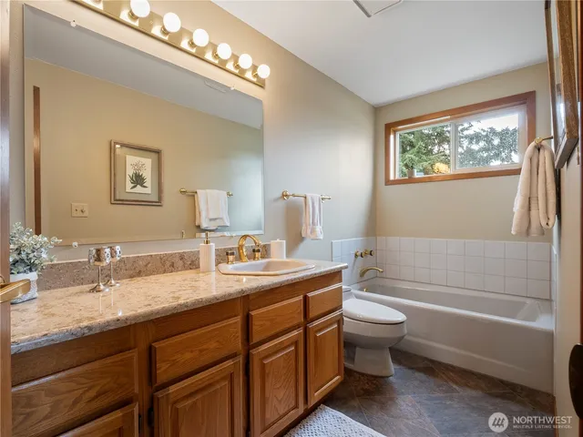a kitchen with a sink cabinets and window