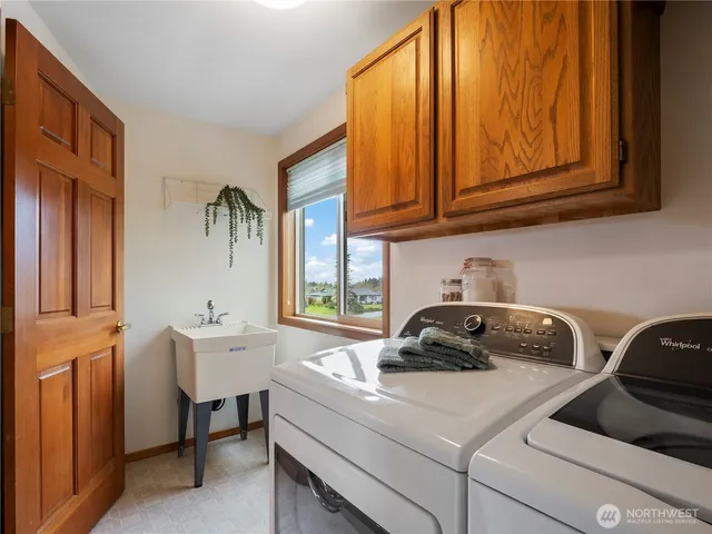 a view of a livingroom with furniture and a flat screen tv
