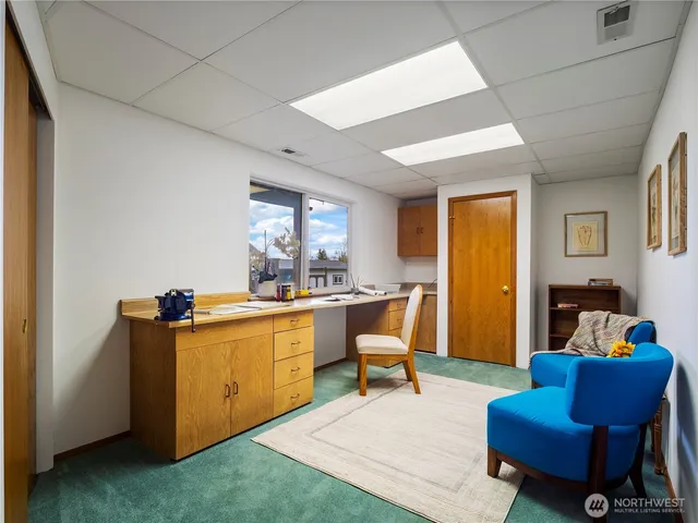 a view of an entryway with a floor to ceiling window