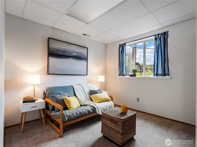 a view of a room with air conditioner duct and materials on floor