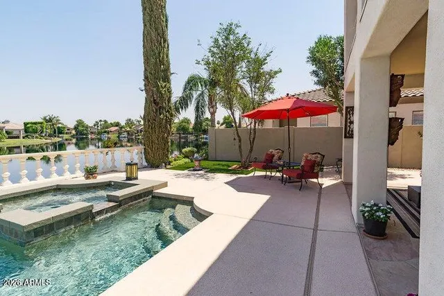 a view of a lake with boats and trees in the background