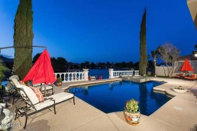 a view of a house with backyard porch and sitting area