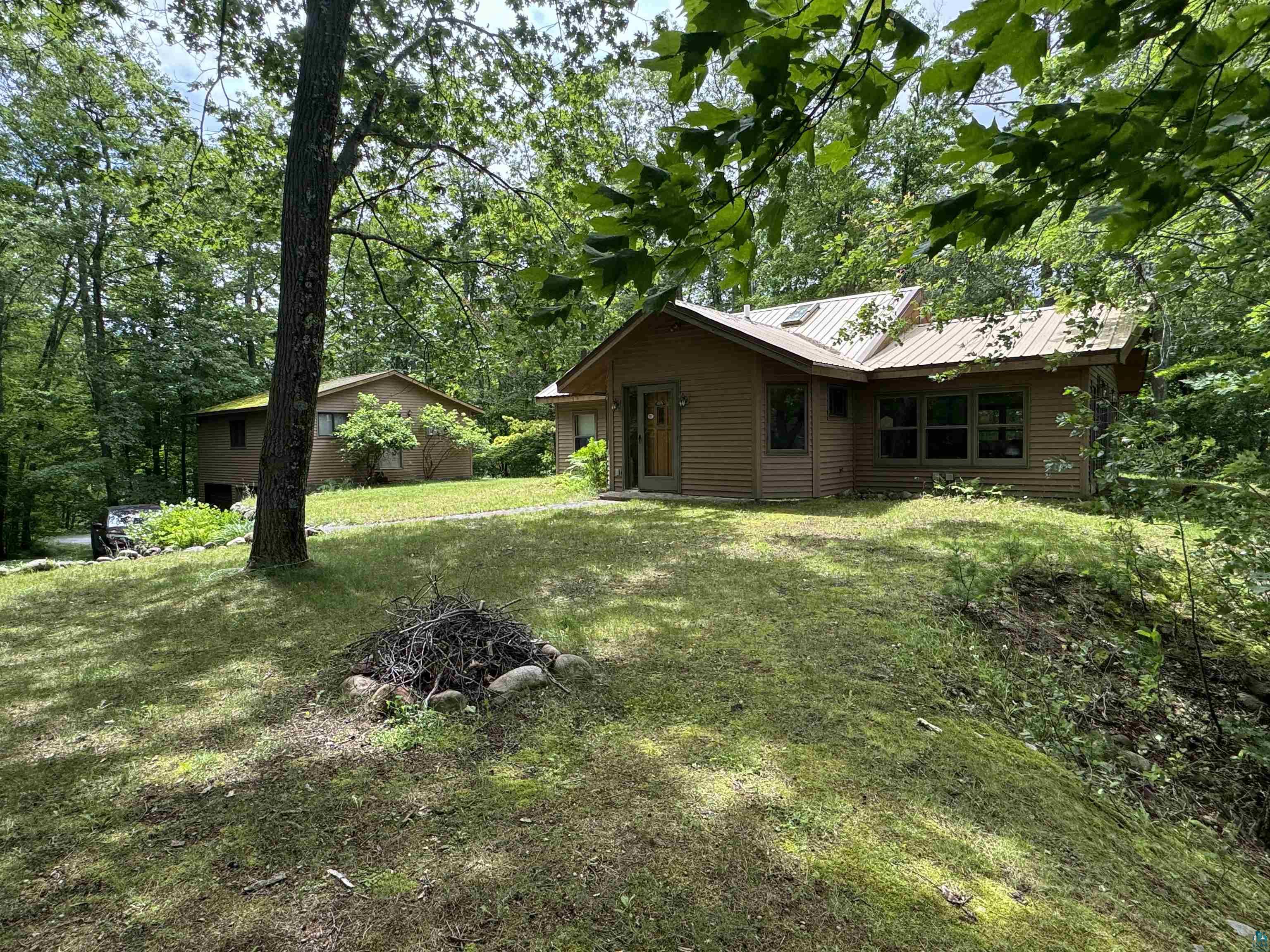 10690 Cedar Crest Road Iron River, WI 54847 - Photo 3 of 24 View of yard, home and garage