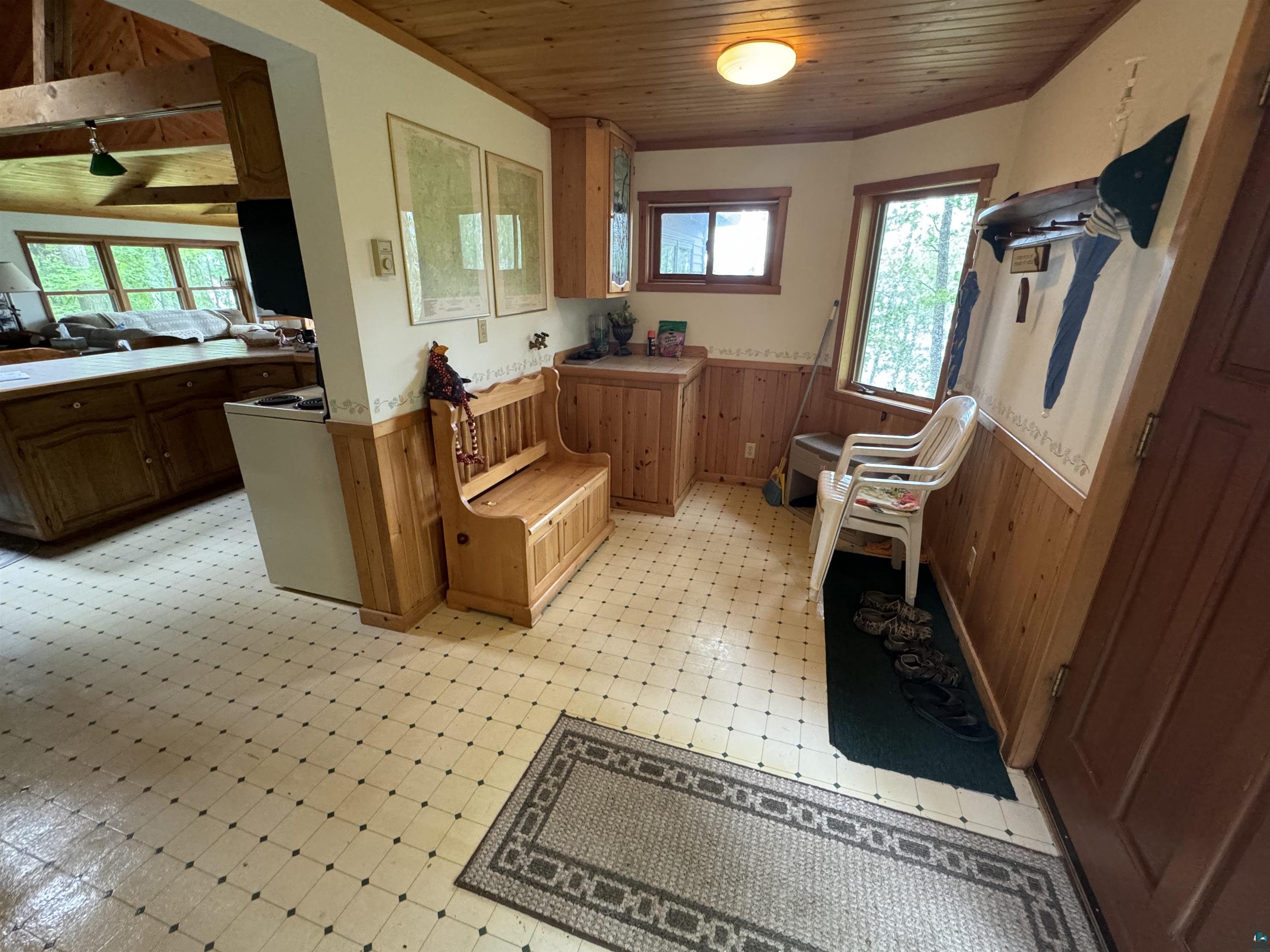 10690 Cedar Crest Road Iron River, WI 54847 - Photo 4 of 24 Interior space featuring light tile floors and wood ceiling