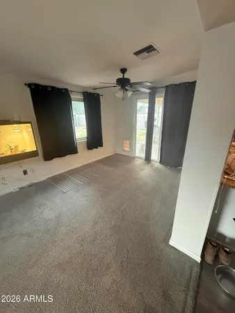 a view of an empty room with a window