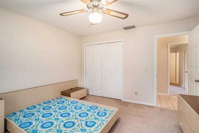 a view of an empty room with a chandelier