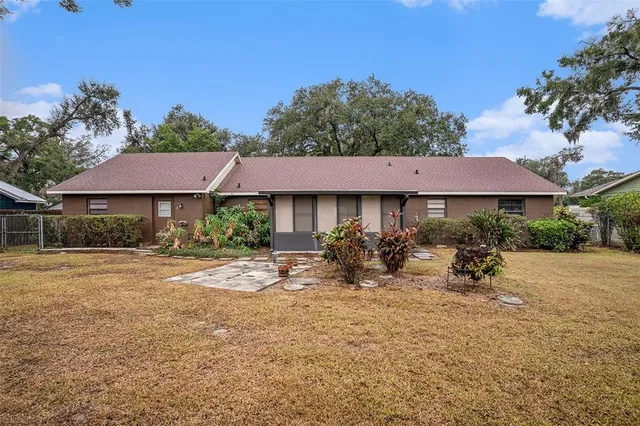 a view of a patio with table and chairs under an umbrella