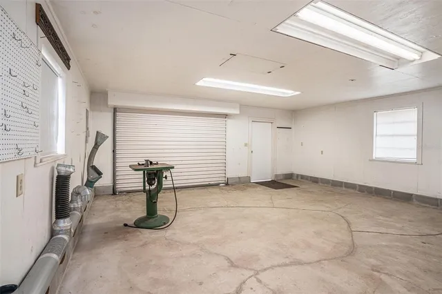 a view of a livingroom with furniture and a window