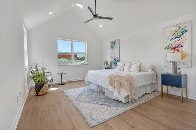 a view of walk in closet with wooden floor
