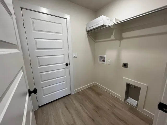 a view of walk in closet with empty racks