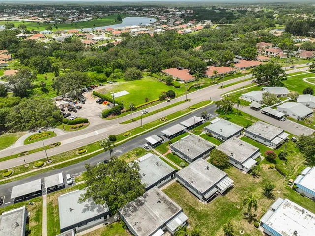 a view of a chairs and table in backyard