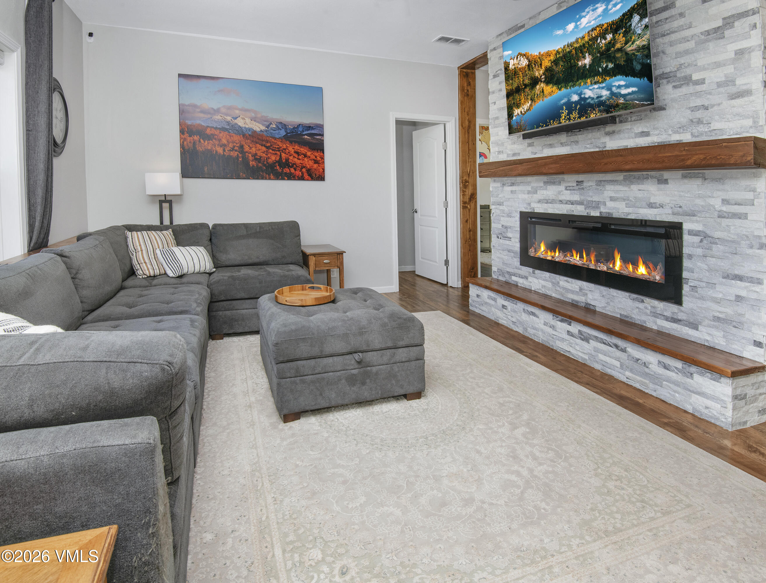 67 Maverick Court Gypsum, CO 81637 - Photo 3 of 40 a living room with furniture and a fireplace