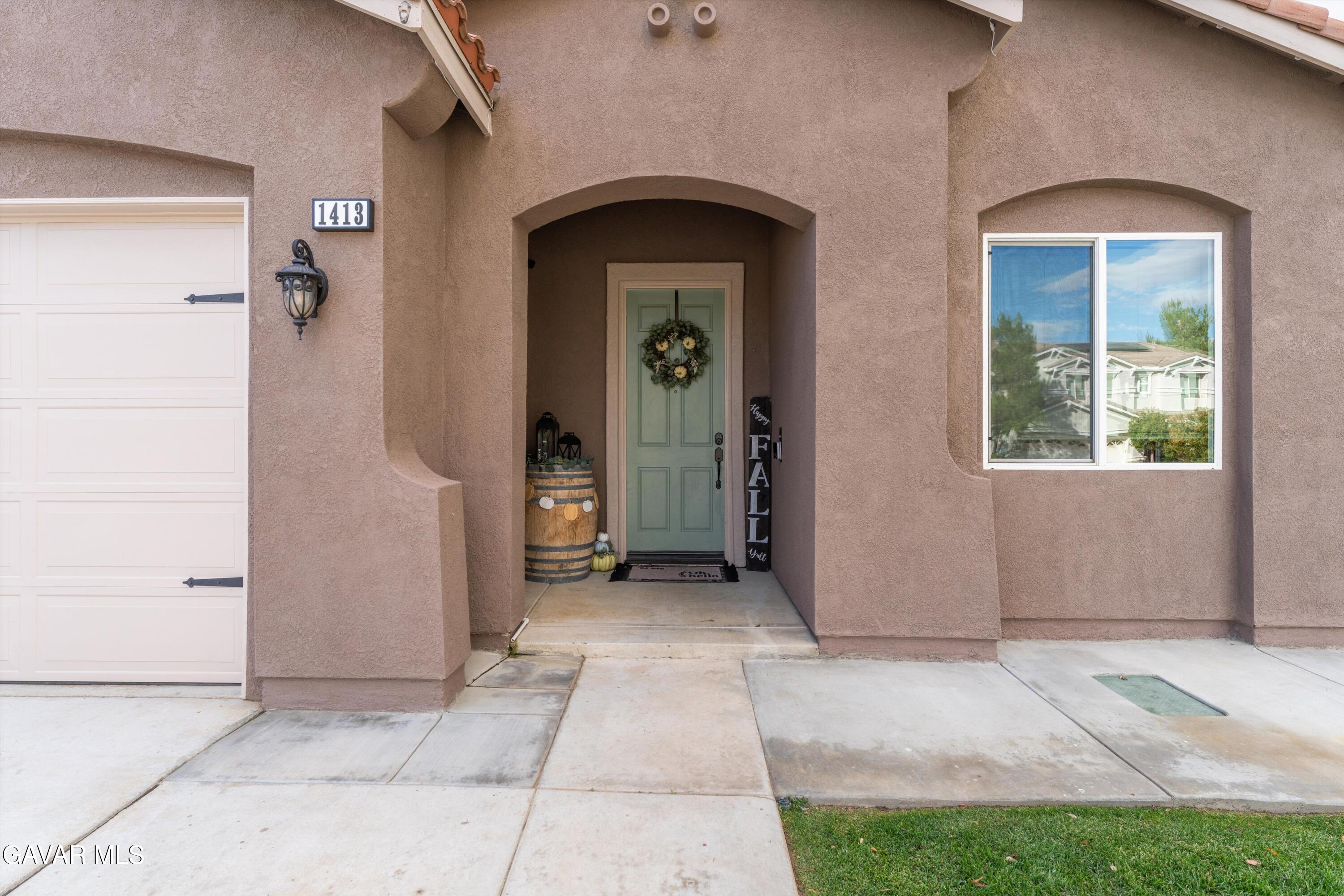 1413 Wild Olive Road Tehachapi, CA 93561 - Photo 19 of 29 an entrance view of a house with a porch