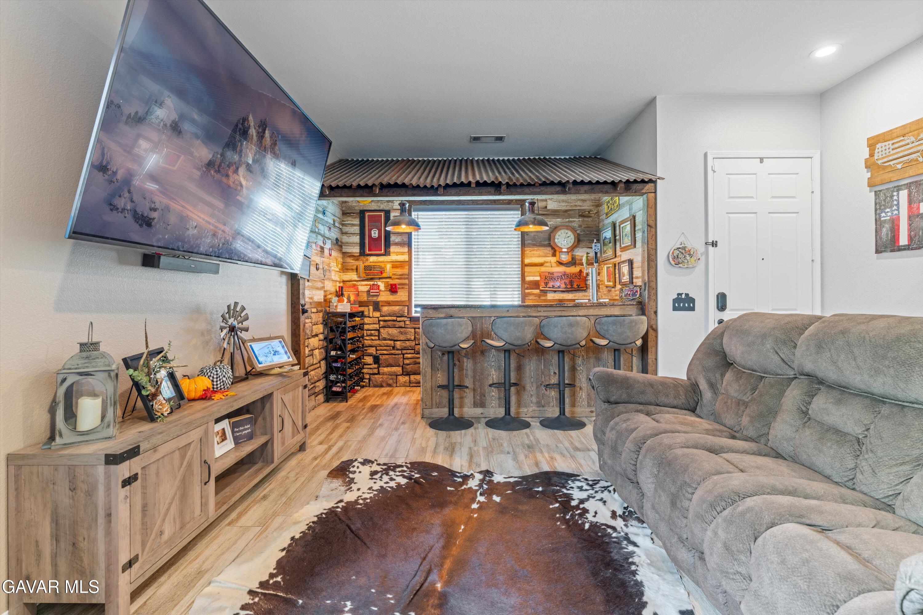 1413 Wild Olive Road Tehachapi, CA 93561 - Photo 20 of 29 a living room with furniture and a large window