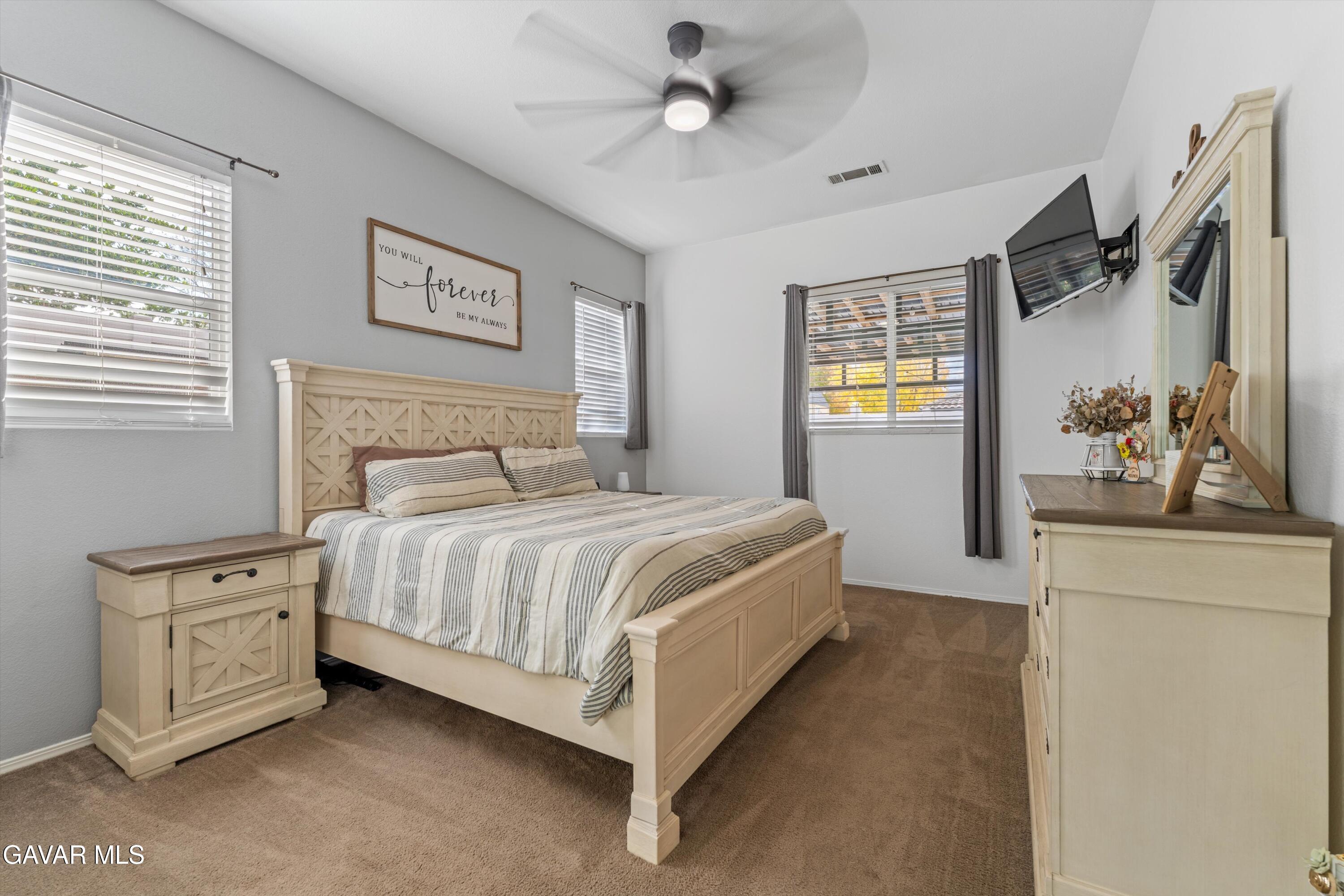 1413 Wild Olive Road Tehachapi, CA 93561 - Photo 27 of 29 a bedroom with a bed dresser and a window