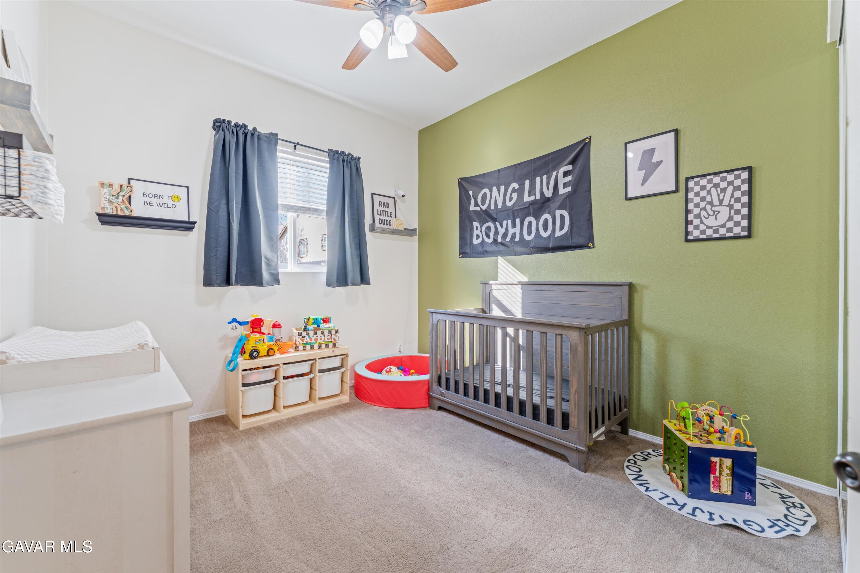 1413 Wild Olive Road Tehachapi, CA 93561 - Photo 4 of 29 a bedroom with furniture and a baby crib