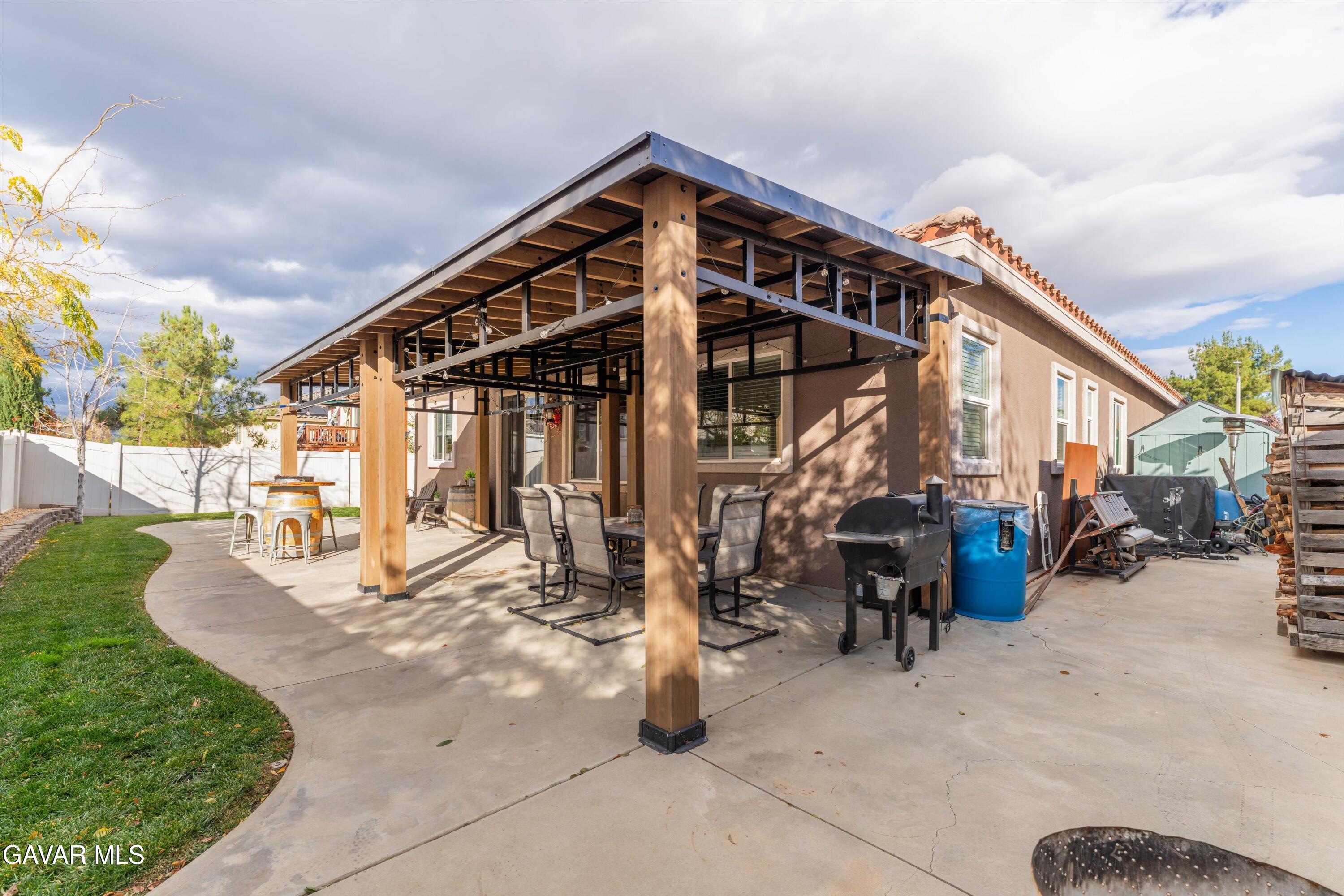 1413 Wild Olive Road Tehachapi, CA 93561 - Photo 7 of 29 a view of a house with backyard porch and sitting area