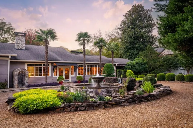 a front view of a house with garden