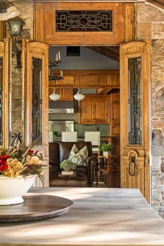 a kitchen with stainless steel appliances granite countertop a lot of counter space and wooden floors
