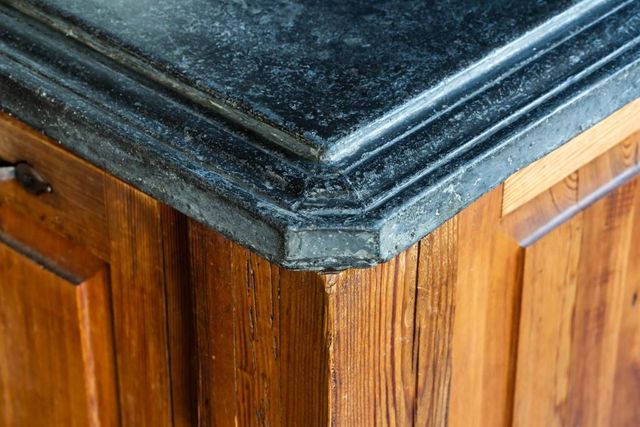 a living room with furniture a fireplace and a window