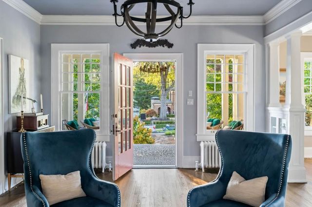 a bathroom with a granite countertop sink a mirror and a shower