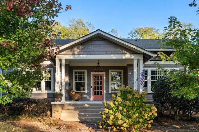 a spacious bathroom with a double vanity sink a mirror and a shower