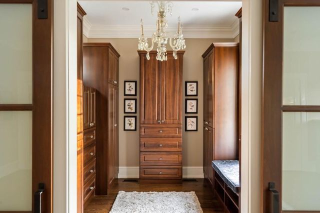 a front view of a house with yard and outdoor seating