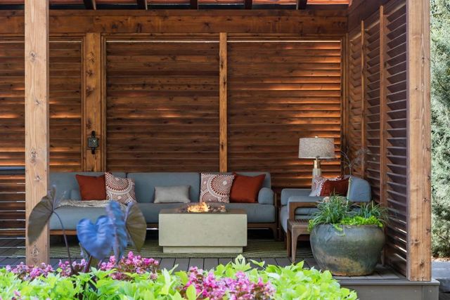 a front view of a house with a garden