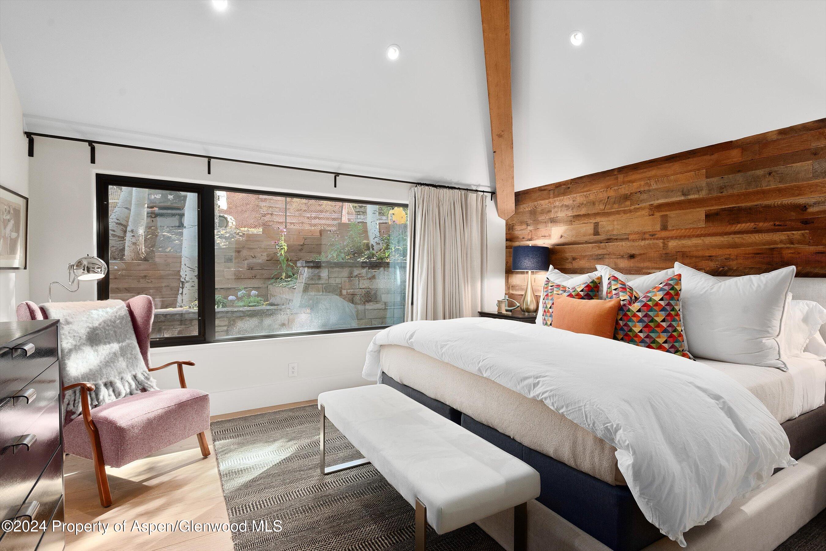 234 Bridge Lane Snowmass Village, CO 81615 - Photo 19 of 46 a bed room with a bed and a couch