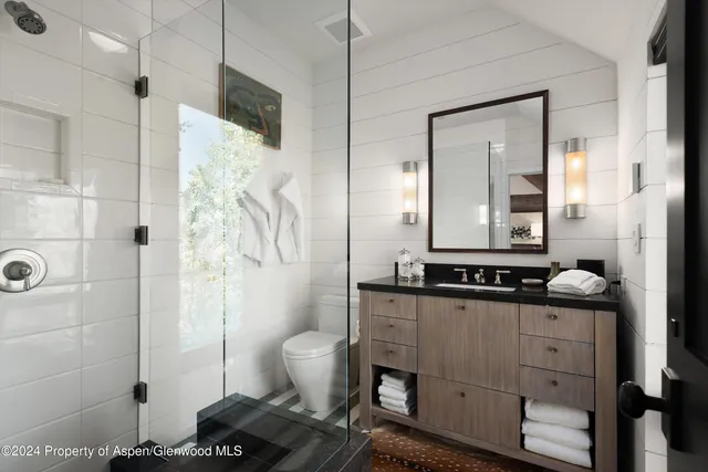 a large white bed in a white room