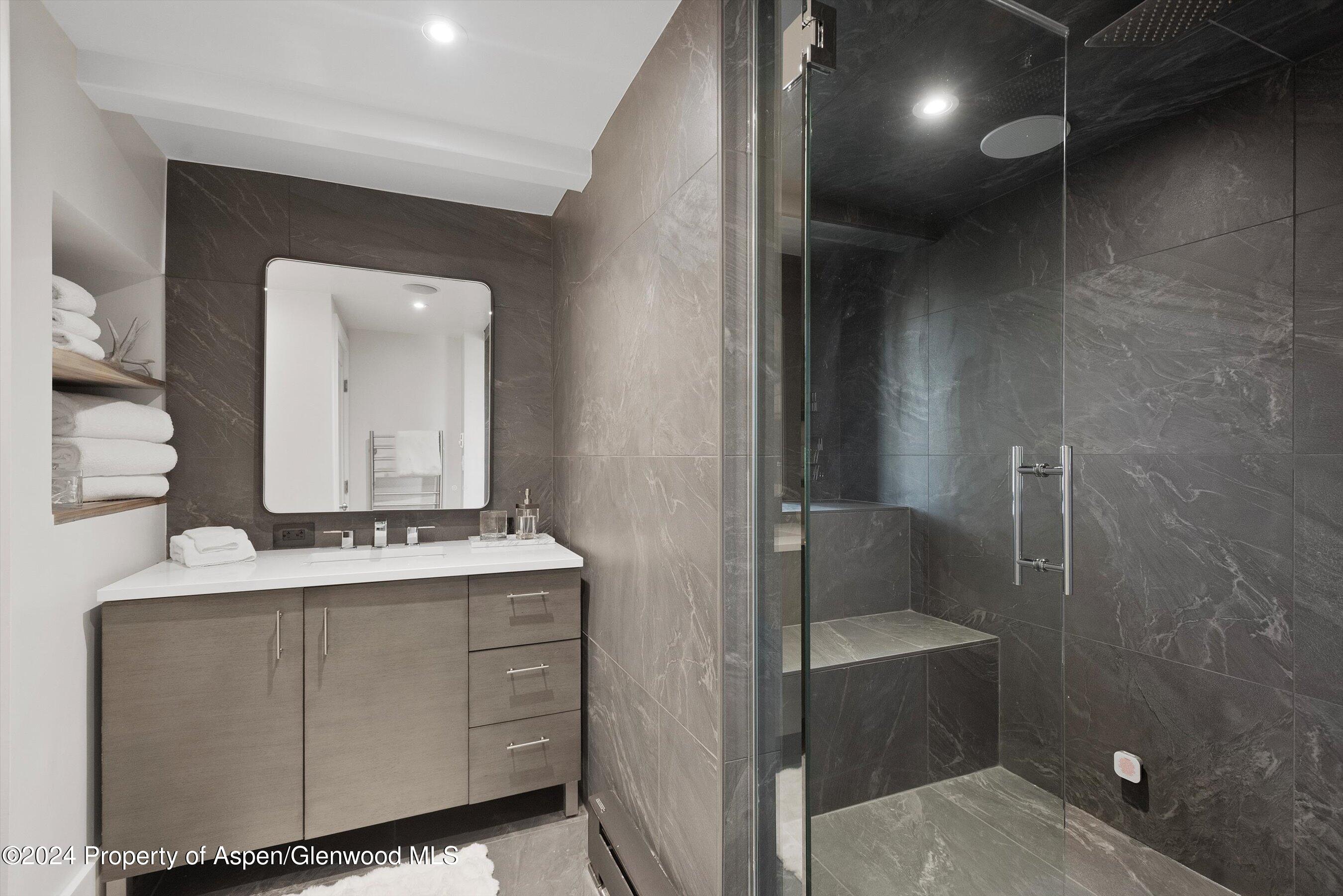 234 Bridge Lane Snowmass Village, CO 81615 - Photo 28 of 46 a bathroom with a double vanity sink and mirror