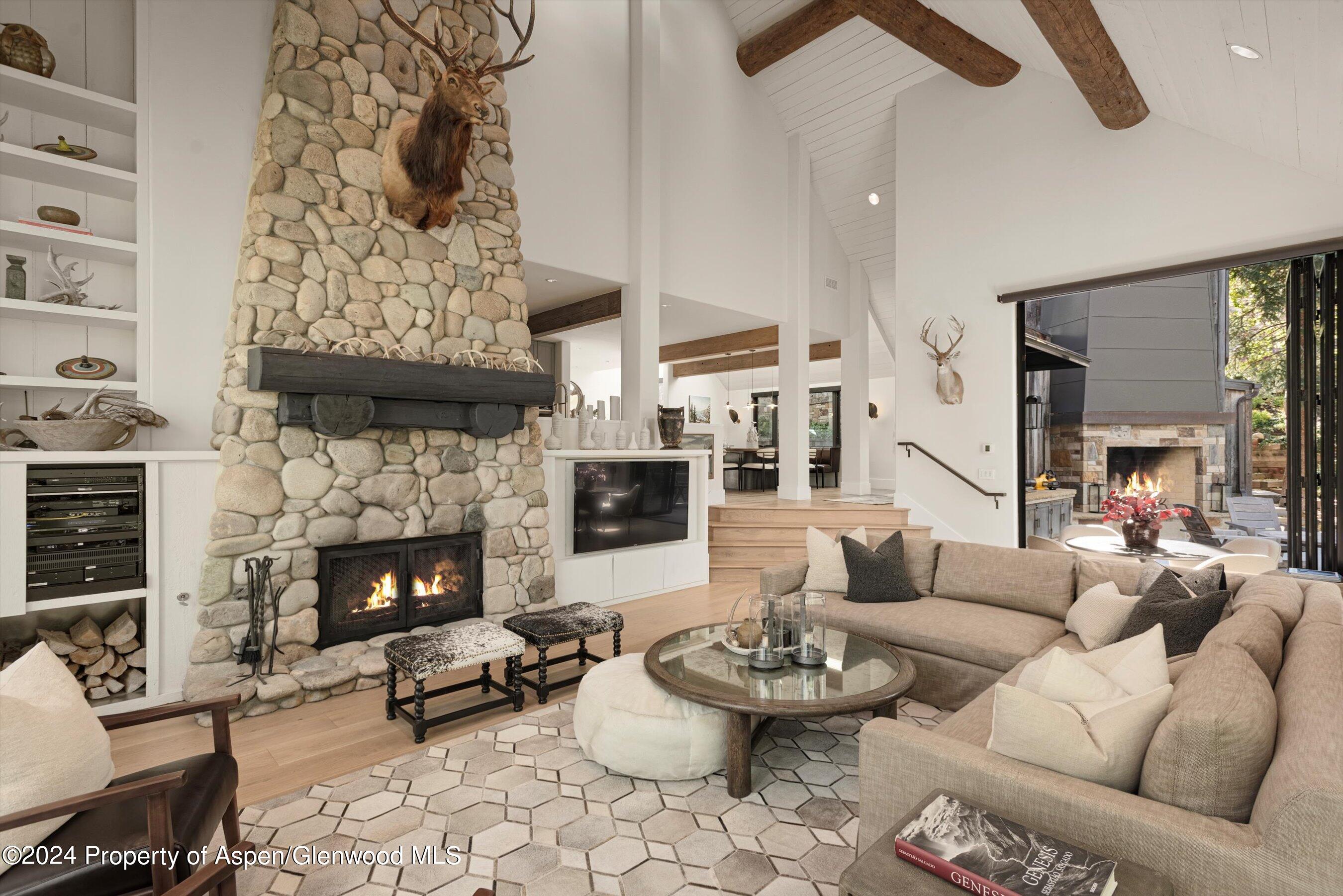 234 Bridge Lane Snowmass Village, CO 81615 - Photo 4 of 46 a living room with furniture and a fireplace