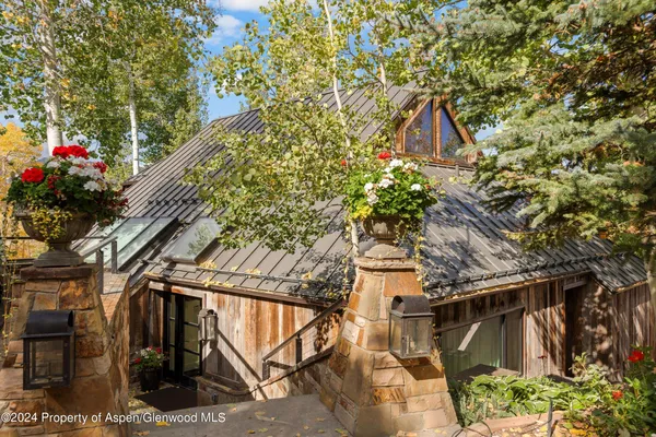a view of entryway and hall with a chair