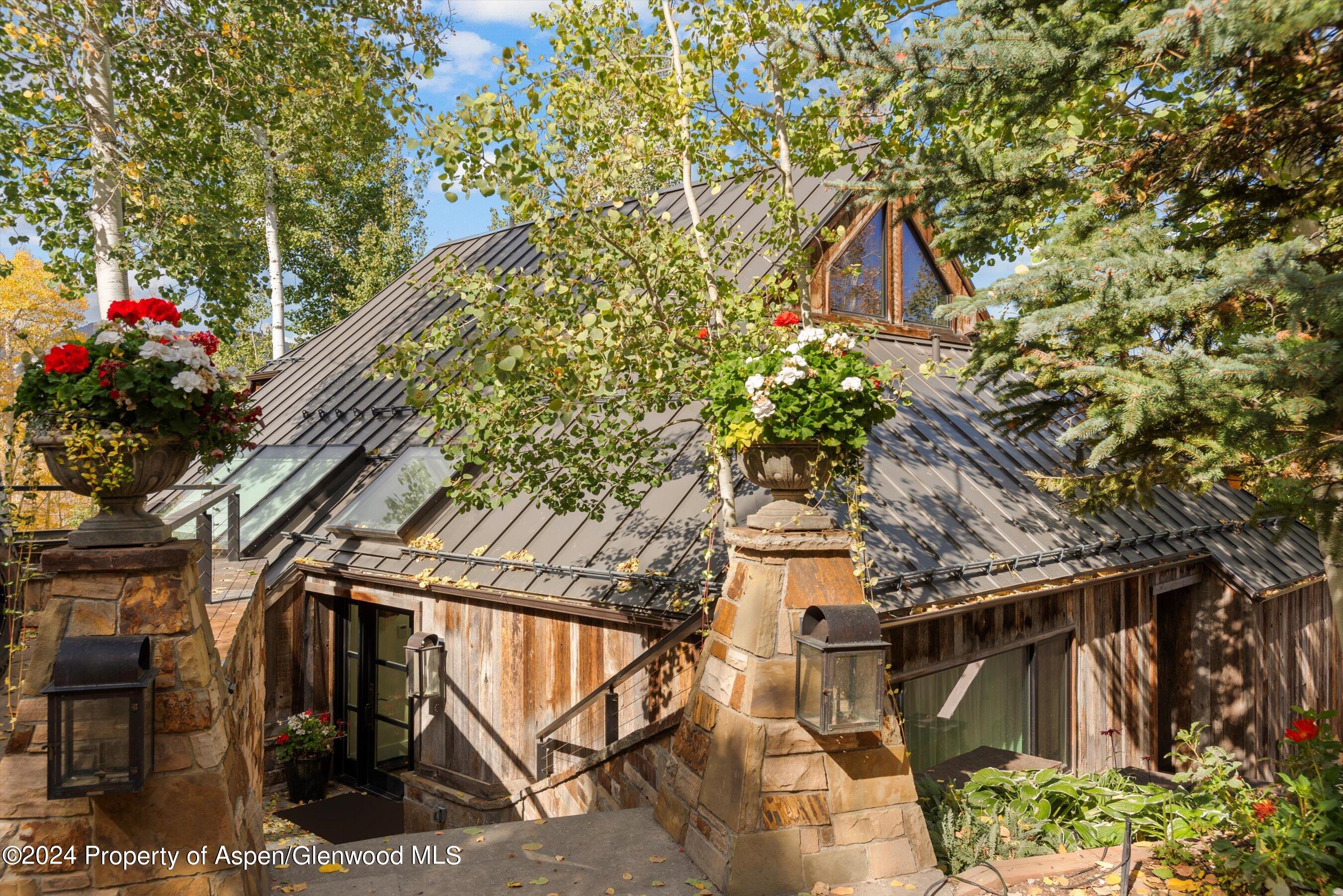 234 Bridge Lane Snowmass Village, CO 81615 - Photo 42 of 46 a backyard of a house with lots of green space