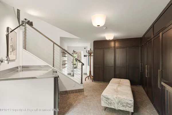 a dining room with a table and chairs