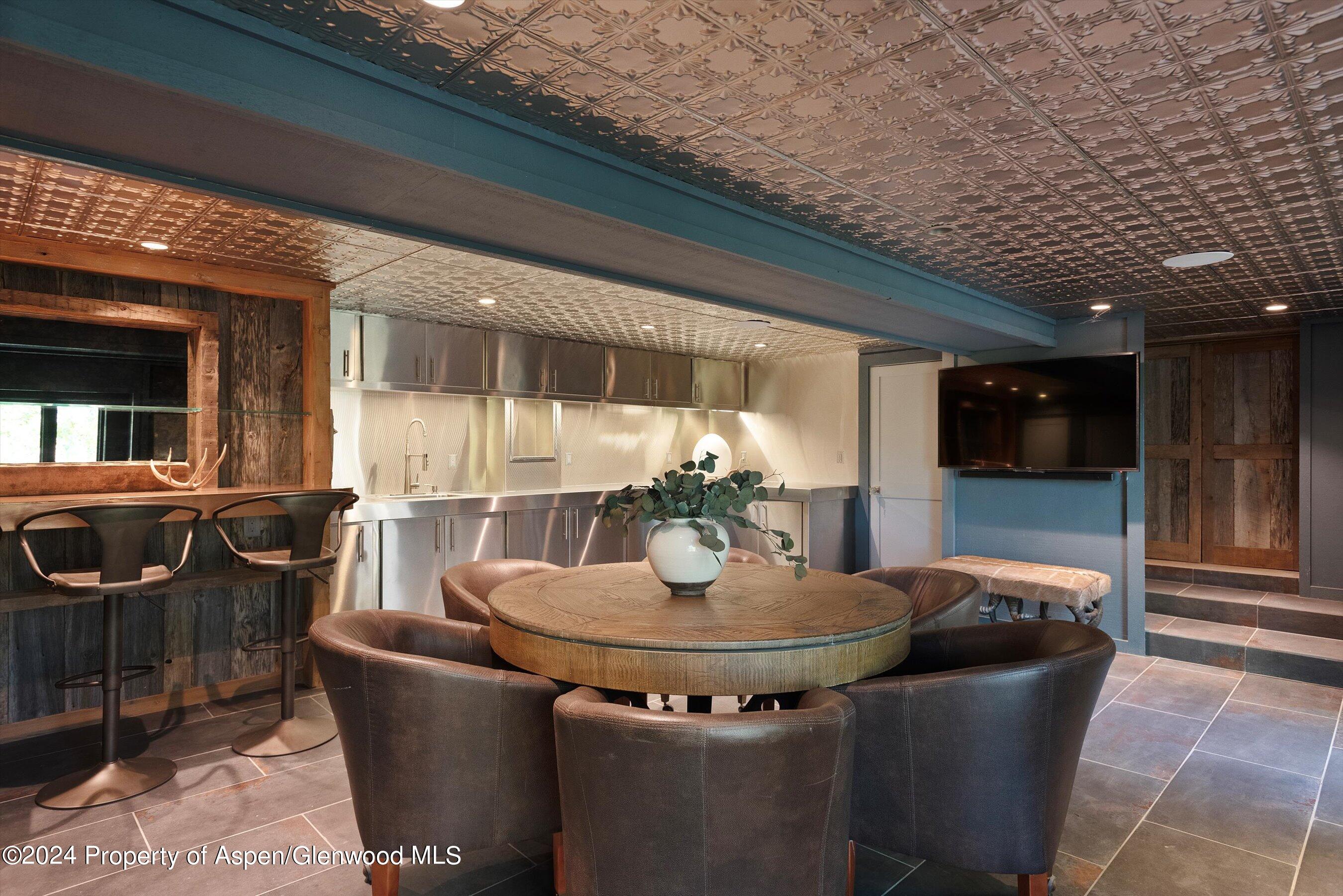 234 Bridge Lane Snowmass Village, CO 81615 - Photo 45 of 46 a view of a dining room with furniture and window