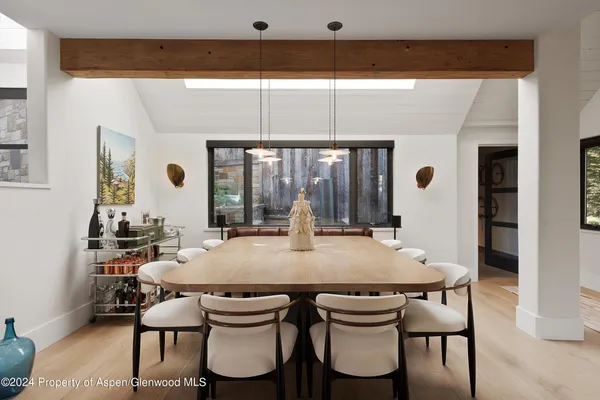 a view of a dining room with furniture and window