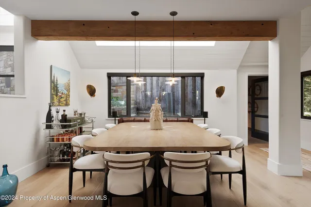 a view of a dining room with furniture and window