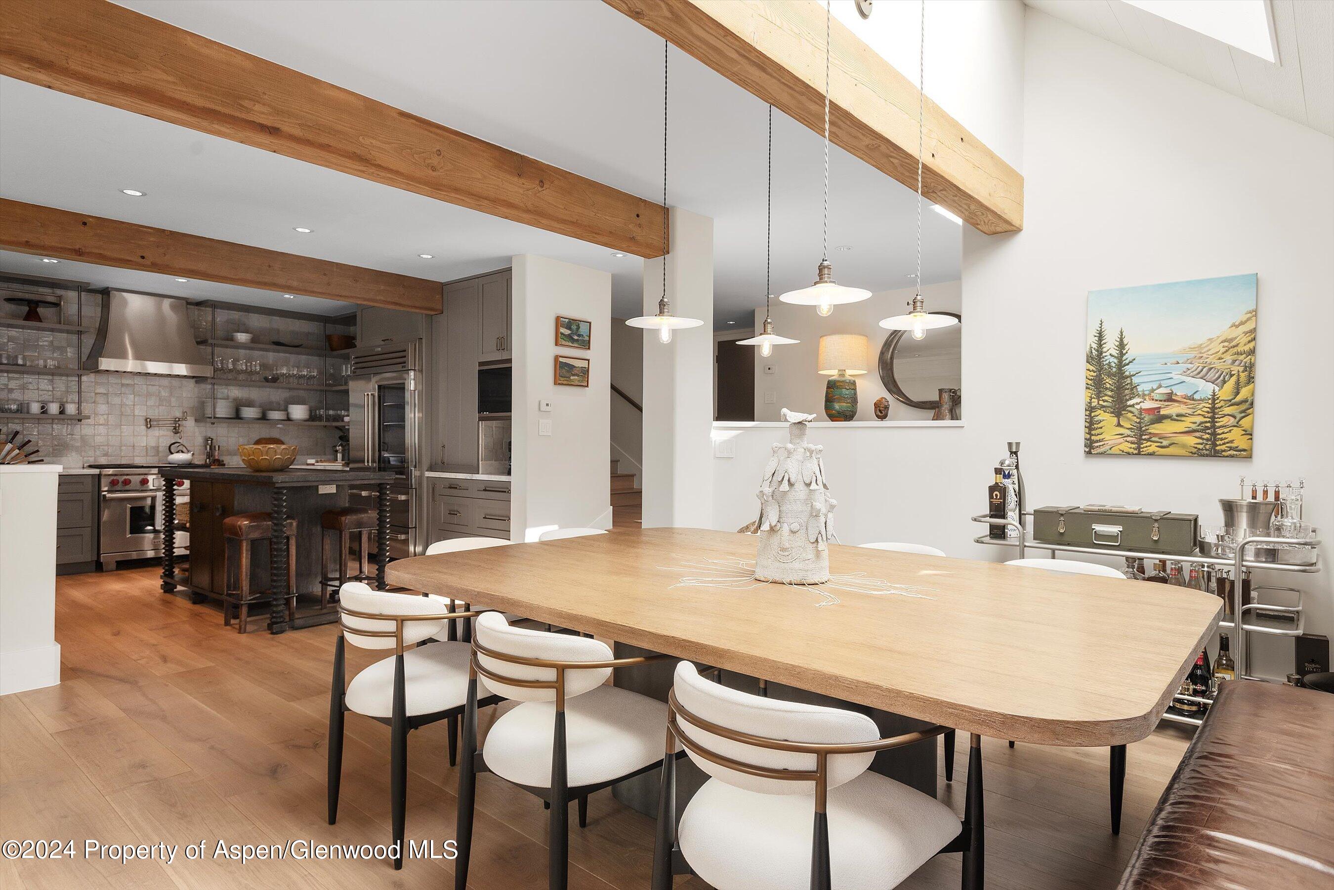234 Bridge Lane Snowmass Village, CO 81615 - Photo 9 of 46 a kitchen with a table and chairs in it