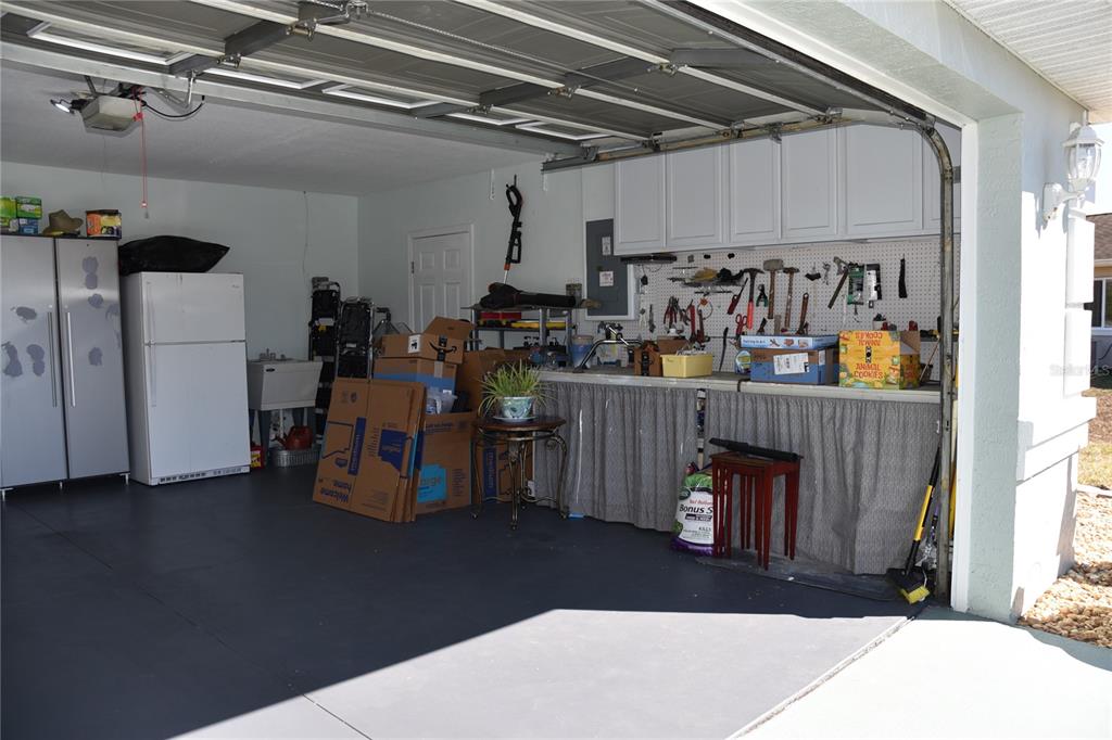 10447 Southwest 62nd Court Ocala, FL 34476 - Photo 52 of 58 a room with lots of furniture and clutter