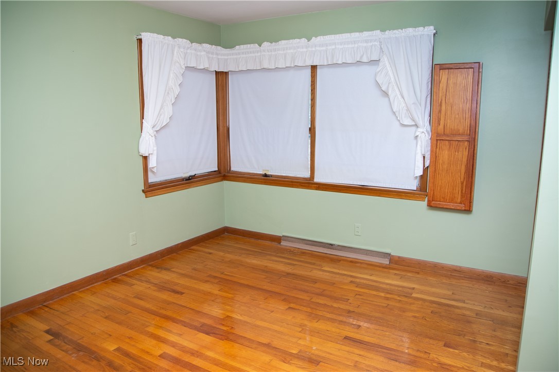 10050 New Buffalo Road Canfield, OH 44406 - Photo 24 of 49 Unfurnished room with hardwood flooring