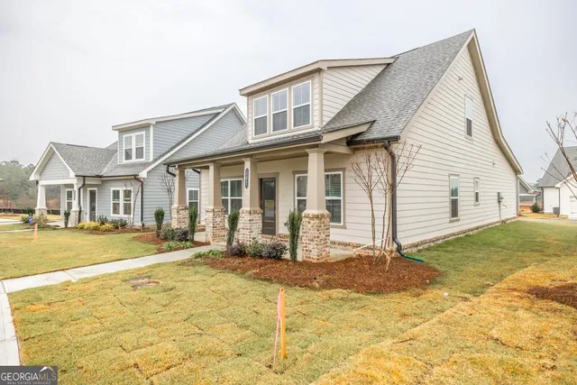 a front view of a house with a yard